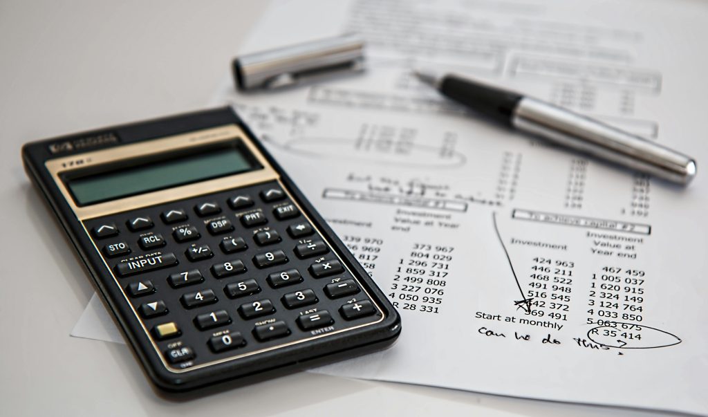 calculator calculation insurance finance 53621 53621 Close-up of financial documents with calculator and pen, ideal for business management themes.